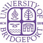 Purple text surrounding a purple seal with a flame in the upper left corner, a tree in the left upper corner, a bird flying over water in the lower left corner, and arches in the lower right corner. The text reads, 'University of Bridgeport, MCM XXVII'.