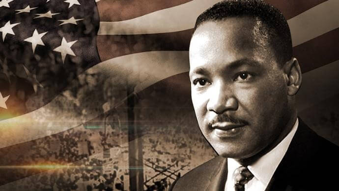 Martin Luther King Jr. with American flag in background