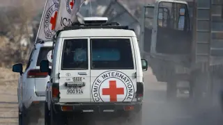 Red Cross vehicles transport a body, identified by Hamas as that of deceased Israeli soldier Hadar Goldin, in Deir al-Balah, central Gaza Strip, on November 9, 2025.