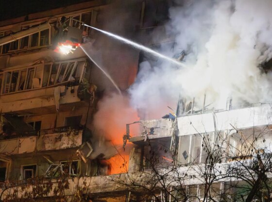 An image collage containing 1 images, Image 1 shows Firefighters spray water on a residential building on fire after a drone attack in Kyiv, Ukraine