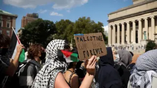 A pro-Palestinian protester holds a sign that says Palestine will live forever, on the campus of Columbia University, on the first anniversary of 7-O, in October of last year.