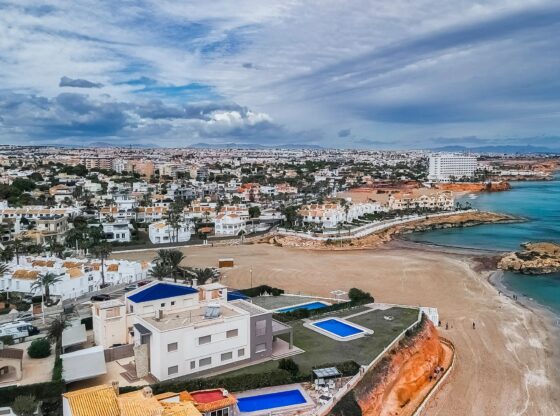 An image collage containing 1 images, Image 1 shows Aerial view of the beaches and coves of Orihuela Costa, Alicante province, Spain