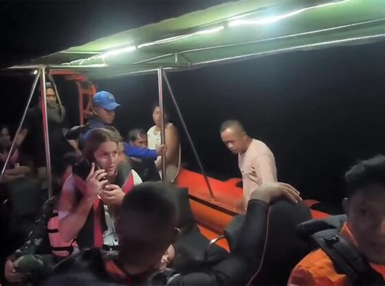 An image collage containing 1 images, Image 1 shows Rescued tourists on a boat in the waters of Padar Island after their boat sank