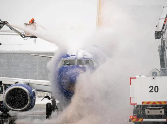 A deicing crew works during Storm 'Fern' at Nashville International Airport, Tennessee.