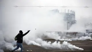 European farmers clash with police during a protest outside the European Parliament in Strasbourg, France.