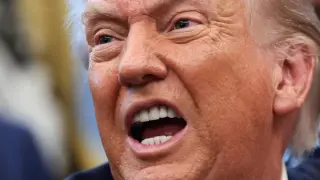 The President of the United States, Donald Trump, appears from the White House.