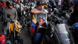 Paramilitary members of the 'Colectivos' group patrol the streets of Caracas