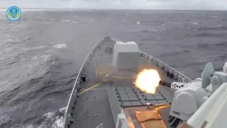A Chinese ship fires a weapon during exercises east of Taiwan.