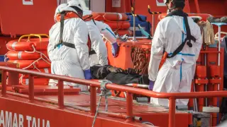 Medical rescue teams help an immigrant who has arrived in a canoe to Arguineguín, in Gran Canaria.